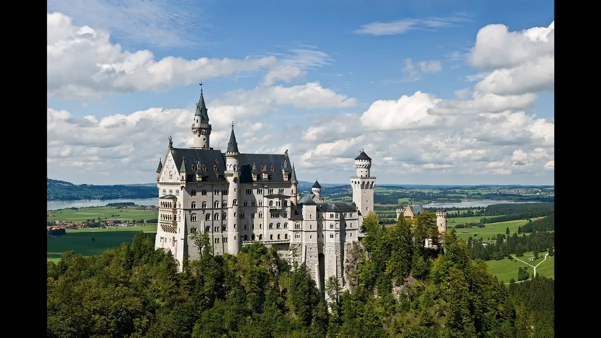 Neuschwanstein Castle in Bavaria on a sunny day, one of the best places to visit in Germany for couples