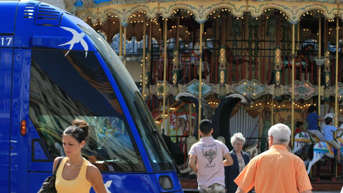 Place de la Comédie in Montpellier France with the Three Graces fountain, opera house and colourful tram