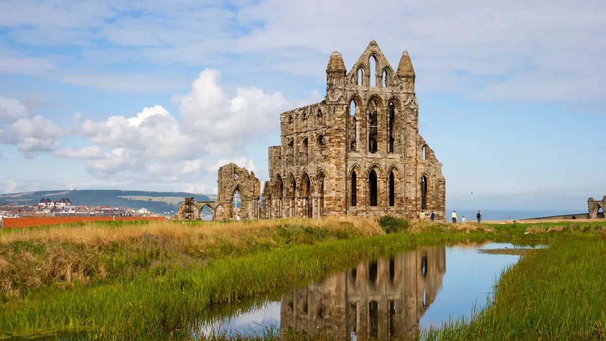 Whitby Abbey ruins above the harbour on the Yorkshire coast in North Yorkshire