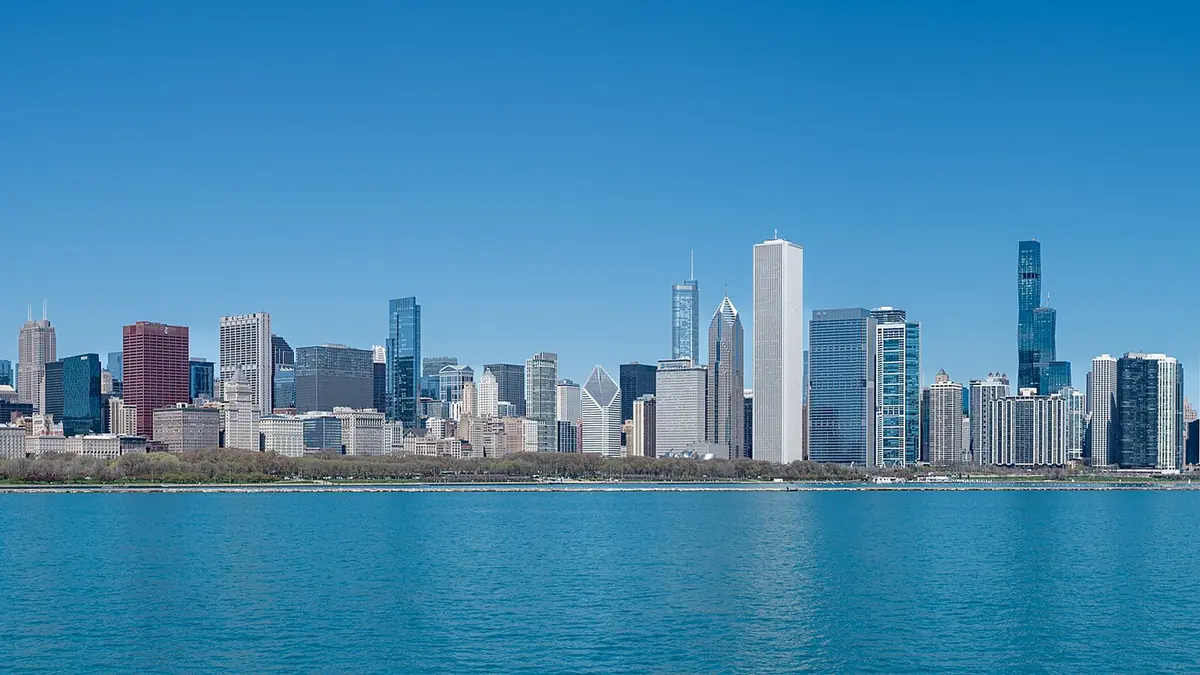 Chicago skyline seen across Lake Michigan on a clear day, with downtown towers including the white Aon Center, representing digital marketing and business growth in Chicago