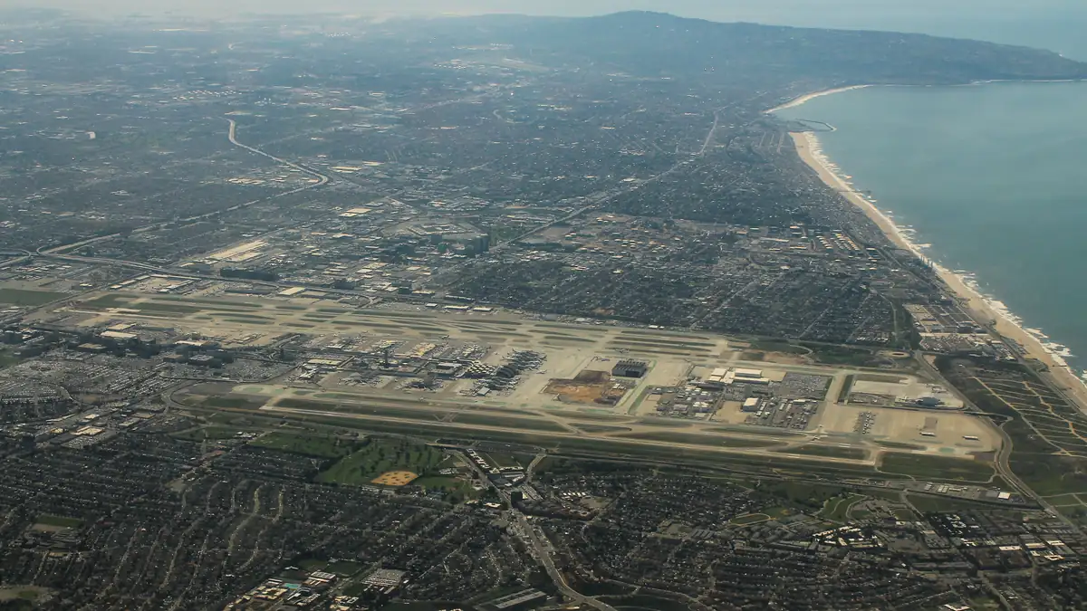 Aerial view of the Los Angeles airport area near Hawthorne, California, showing city streets and businesses below