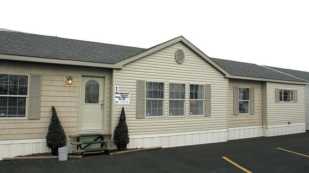 Modern manufactured home set on its own land as part of a land home package