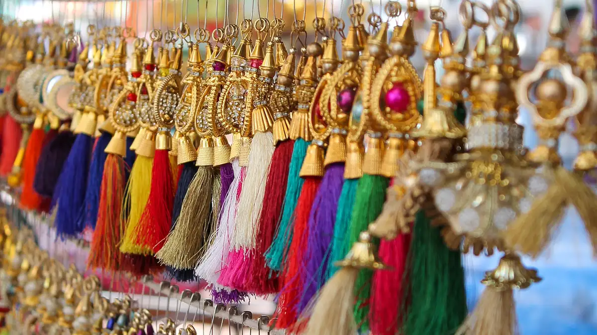 Colourful traditional Indian jhumka earrings with detailed domes and bead fringes