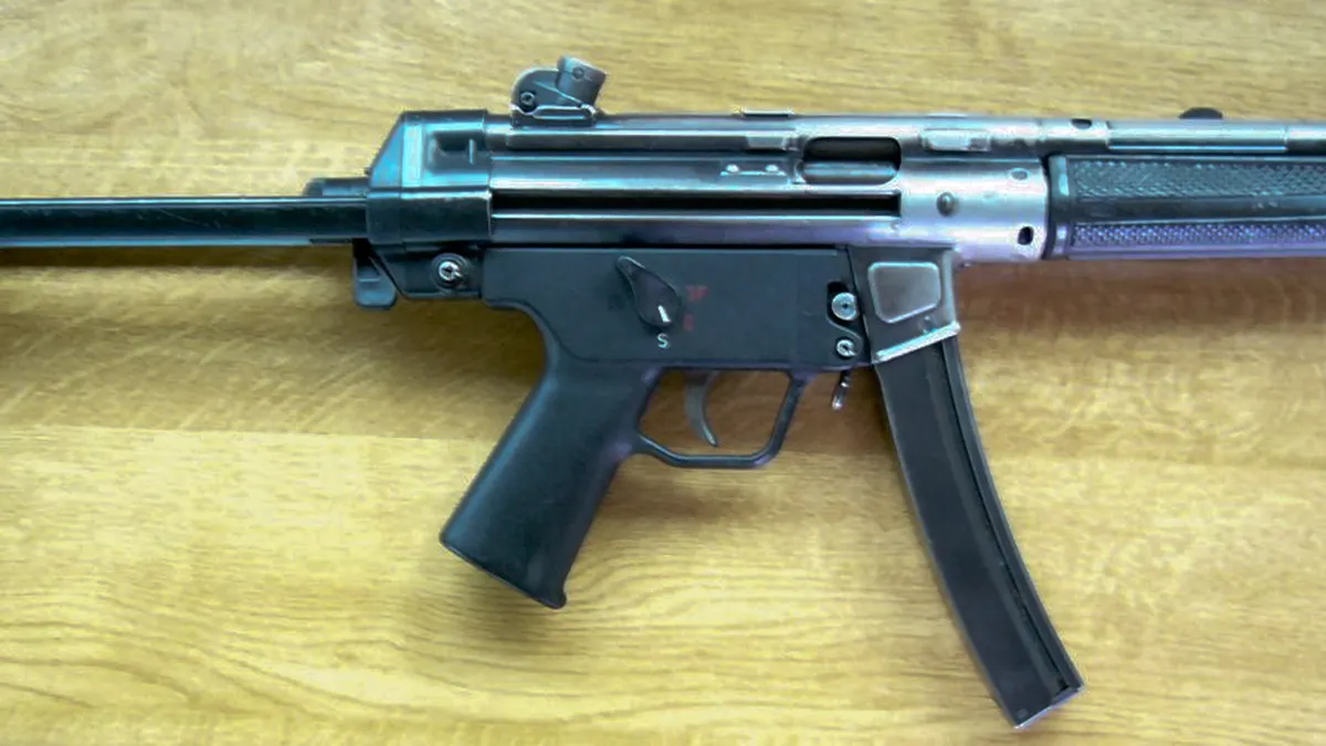 MP5-pattern pistol-caliber carbine with retractable stock shown in side profile