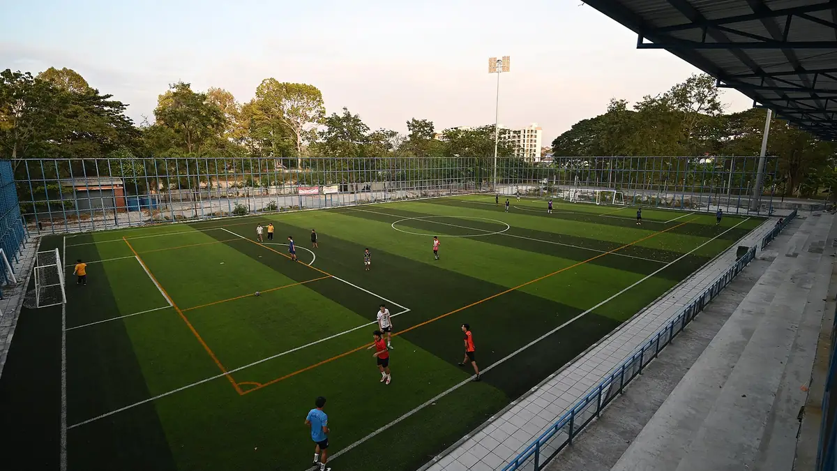 Evening soccer practice on floodlit artificial turf fields at a recreational sports complex, illustrating the outdoor field play at Penberthy Rec Sports Complex