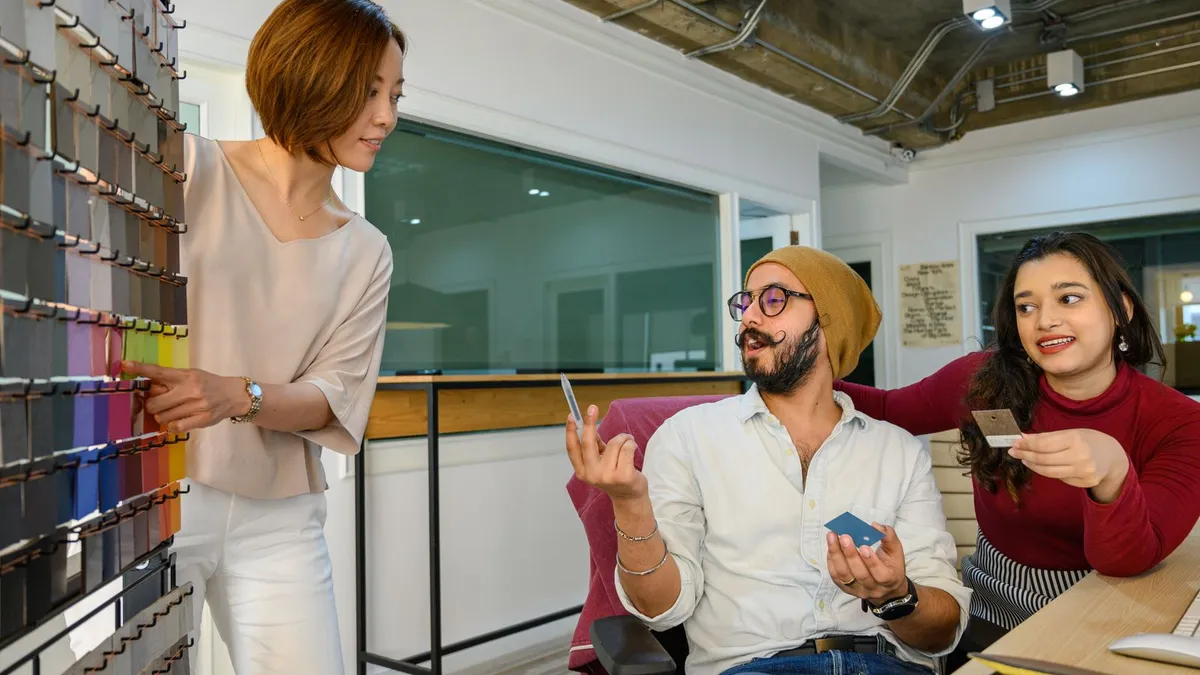 Business team discussing strategy and new ideas around a table in a modern office