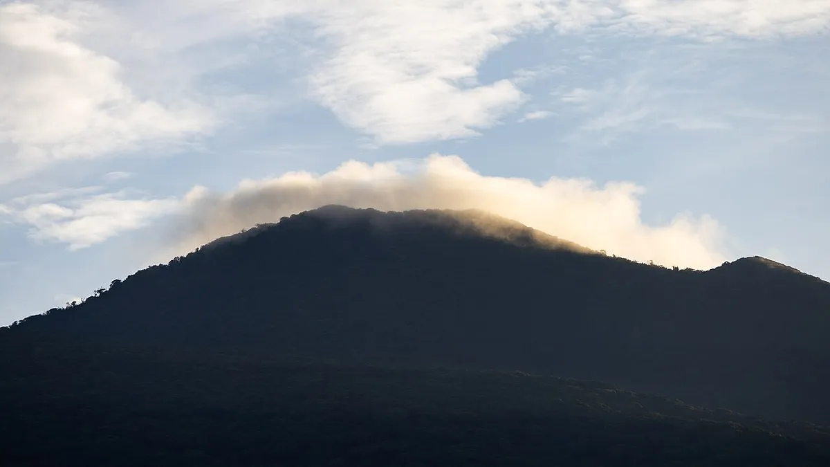 Rincón de la Vieja volcano crater with clouds gathering above its slopes near Liberia in Guanacaste, Costa Rica