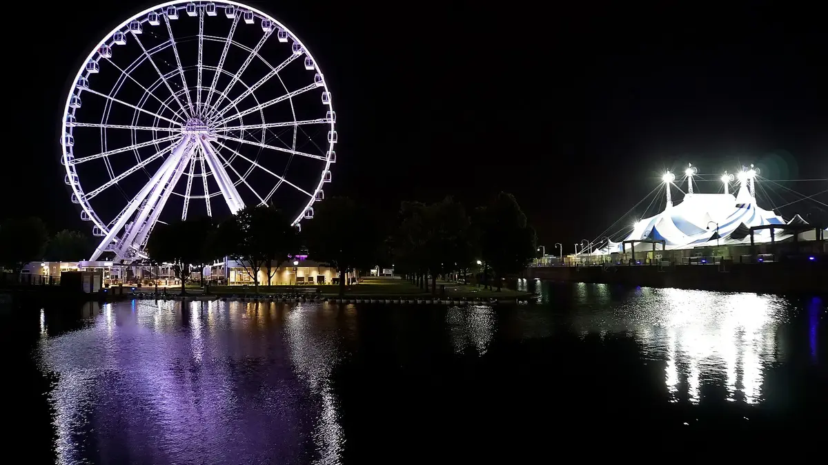 Grande Roue observation wheel and Cirque du Soleil tents at the Old Port of Montreal in summer