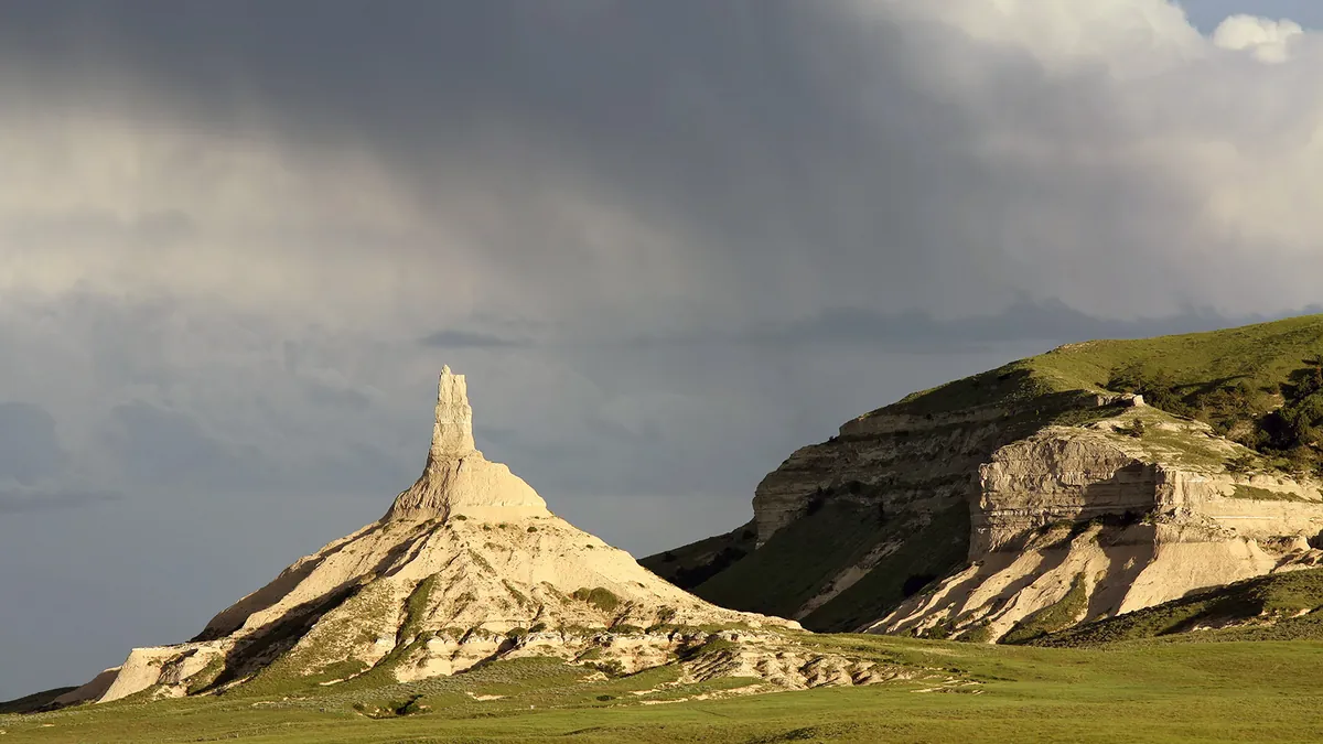 Chimney Rock rising above the prairie in western Nebraska under a wide summer sky
