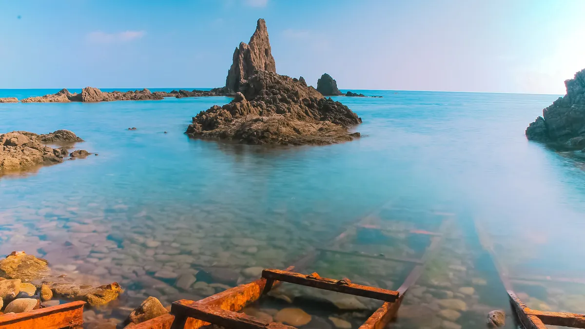 Arrecife de las Sirenas volcanic reefs below the Cabo de Gata lighthouse in Almería, south east Spain