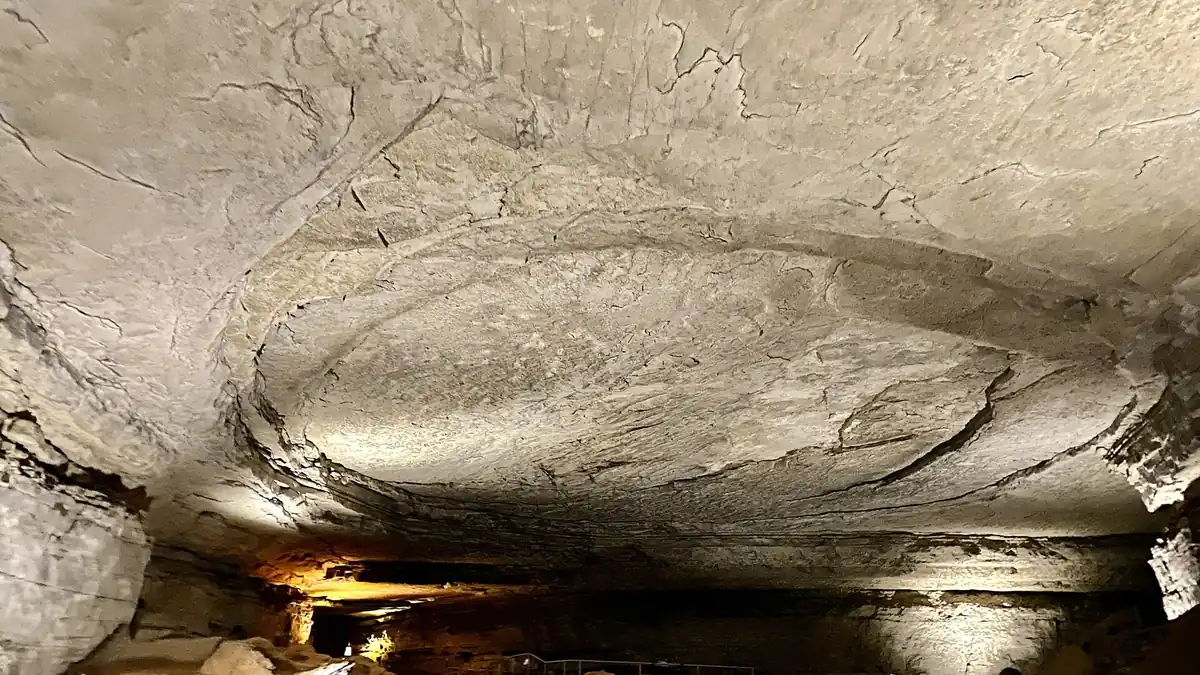 The vast Rotunda room inside Mammoth Cave, with rocky walls and a lit path near Bowling Green, Kentucky