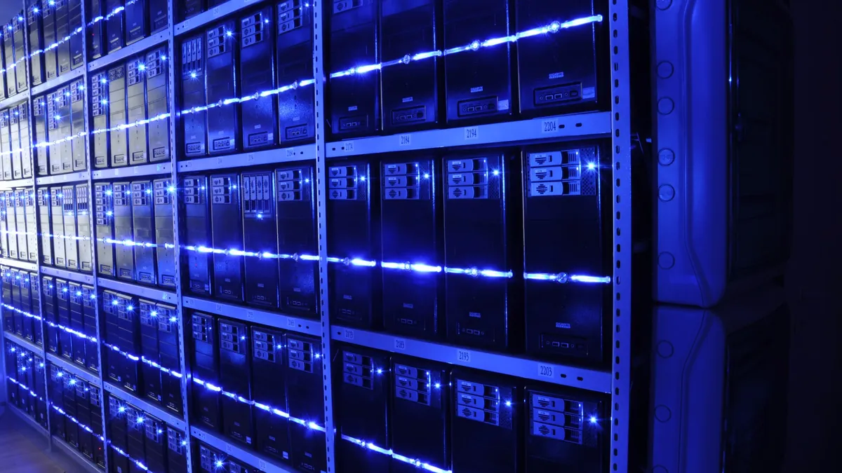 Modern data centre server rows representing the data infrastructure behind a shared marketing and IT strategy