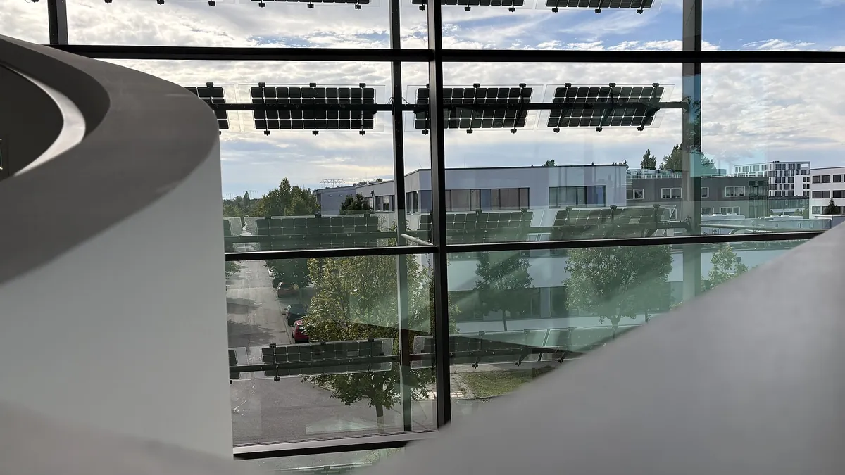 Solar cells mounted on the glass facade of a research building in Berlin-Adlershof, representing sustainable business architecture