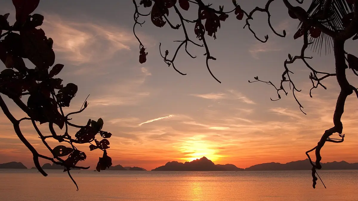 Sunset over El Nido bay and limestone islands in Palawan, Philippines