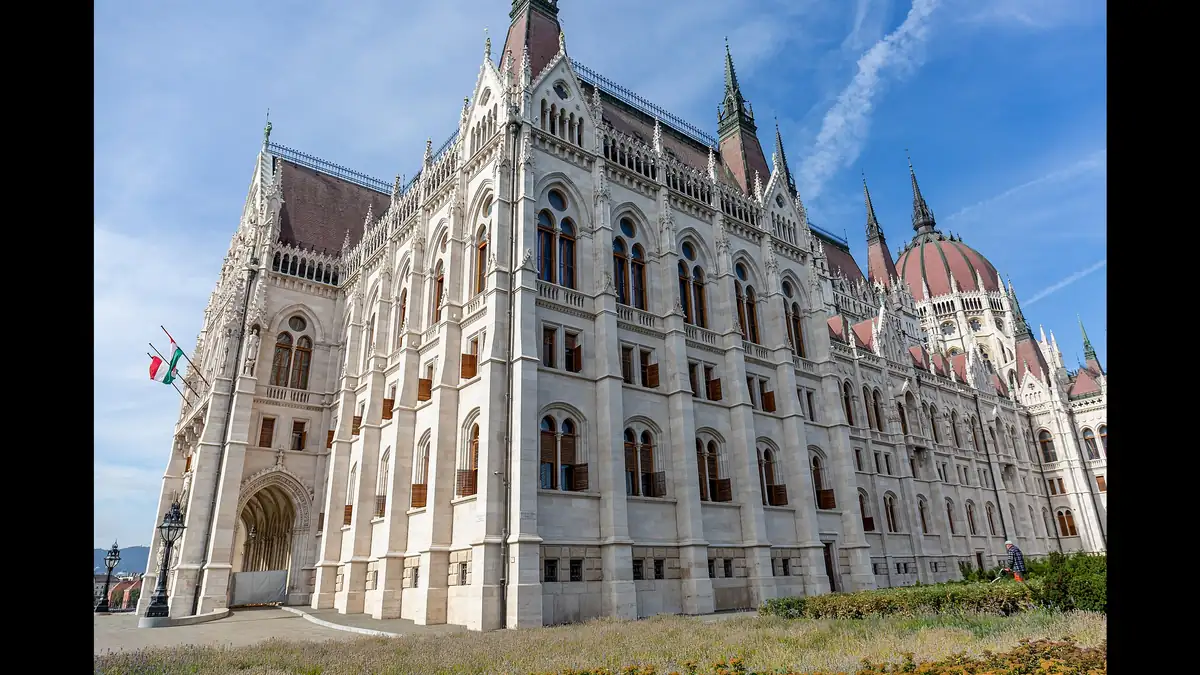 Hungarian Parliament Building on the Danube riverbank in Budapest with its dome and Gothic Revival spires