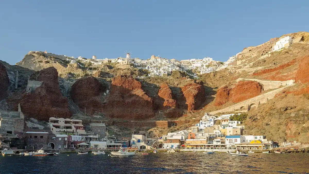 Whitewashed houses and blue domes in Oia above the Santorini caldera in Greece